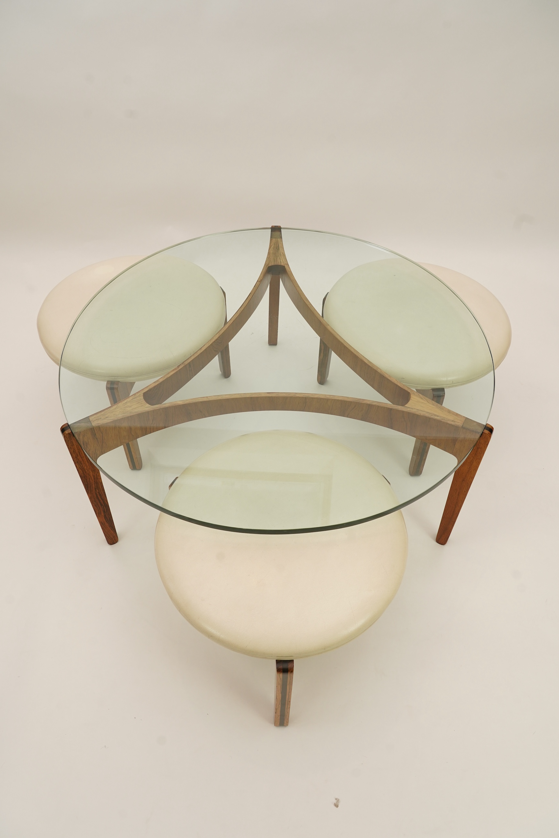Sven Ellekaer (Danish, 1926-1984) for Christian Linneberg Møbelfabrik: A coffee table and three nesting stools ensuite